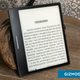 The Onyx Boox Leaf 2 sitting on a wooden table with an ebook displayed on screen.